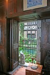 windows open from dining room to Atrium