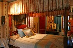 Early American Bedroom - doors are concealed by wallpaper