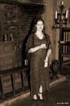 Janine near the fireplace