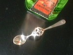 shinny silver dripping spoon