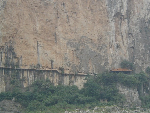 Cliff walk built from planks tucked into wall