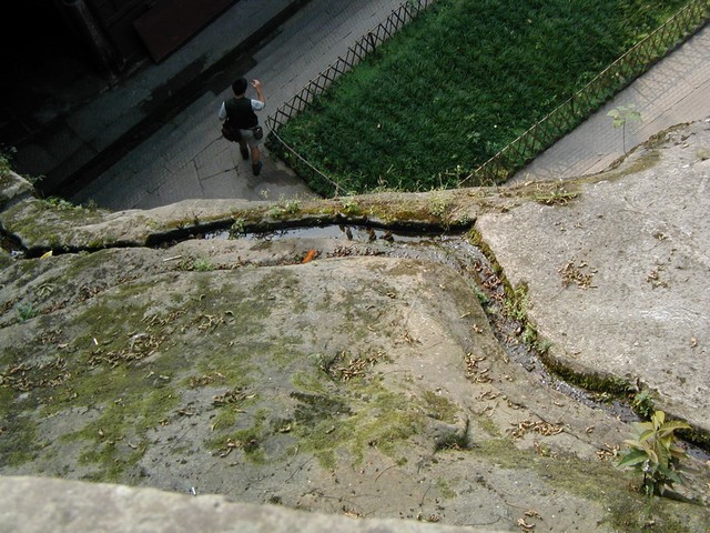 Gazing down into the courtyard below the cliff carvings