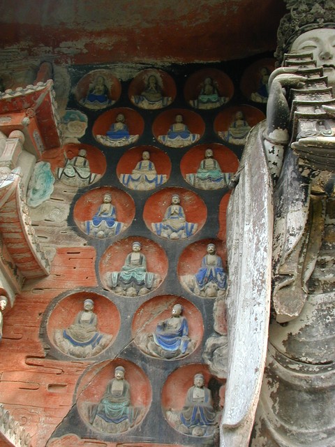 Mini-buddha insets near Manjusri who was one of the three statues of standing saints from the Huayen sect of Buddhism