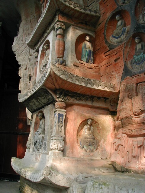 Pagoda near three standing saints