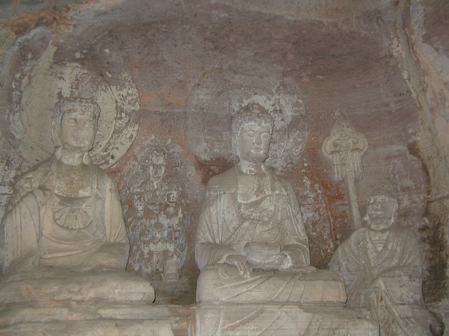Buddhas with trace images of former designs in between