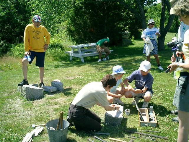 Tom with his stud cap striking a pose on granite