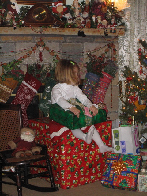 Ella in a sea of gifts