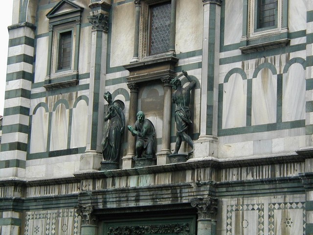 Statuary above Gates of paradise across from Duomo