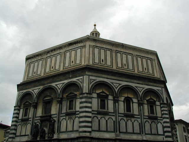 marble facade of building facing Duomo