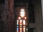 construction inside behind stained glass wall