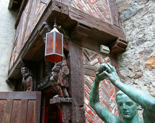 French store front and statue
