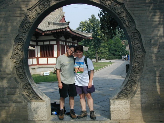 Joe & Ren hug in the moon gate