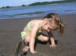 Ella sculpting sand