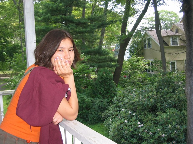 Lisa leaning on the balcony
