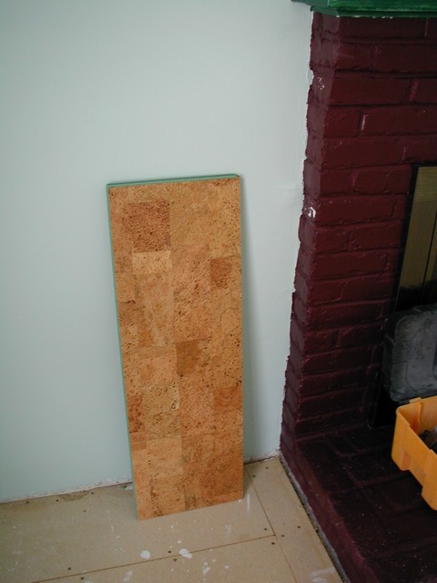 a plank of natural cork propped against the wall
