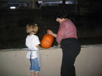 Ella and Sandy carve a pumpkin