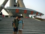 Joe & Ren on the steps at the base of the Oriental Pearl TV Tower