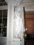 female statue on wall