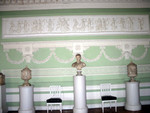 marble busts in mint green room