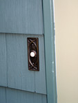 doorbell view - bad caulking and gouged siding