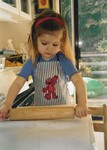 Ella preps the dough