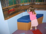 Ella checks out the toy train