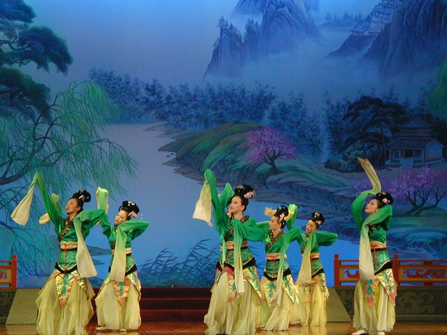 Green costumes with ribbon-like sleeves