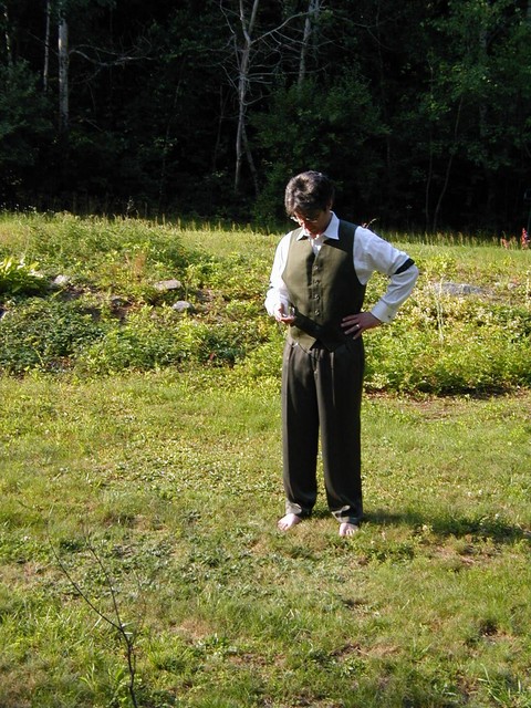 Checking his pocket watch
