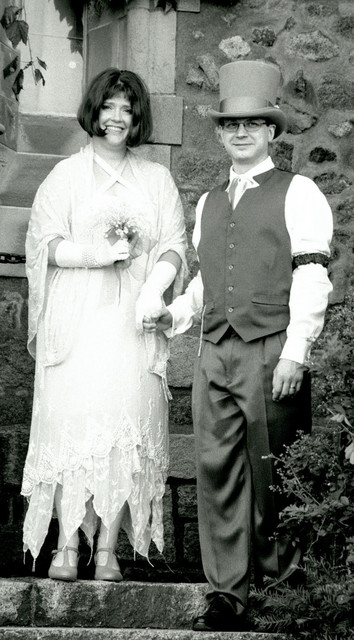 Ren and Joe holding hands on stairs in black and white