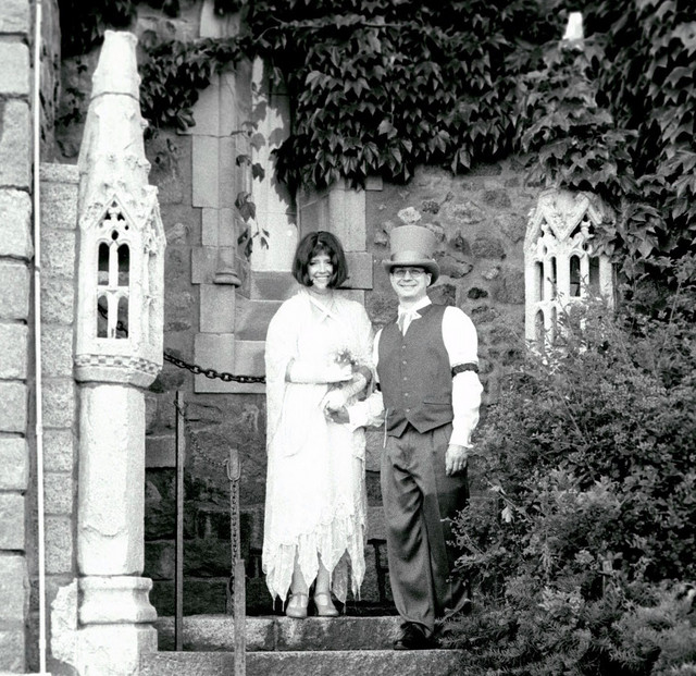Ren and Joe in black and white on stairs - square