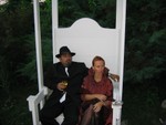 Ajay and Sharon in the big white chair out back