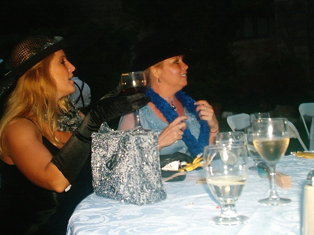 Pam and Lynn sipping red wine